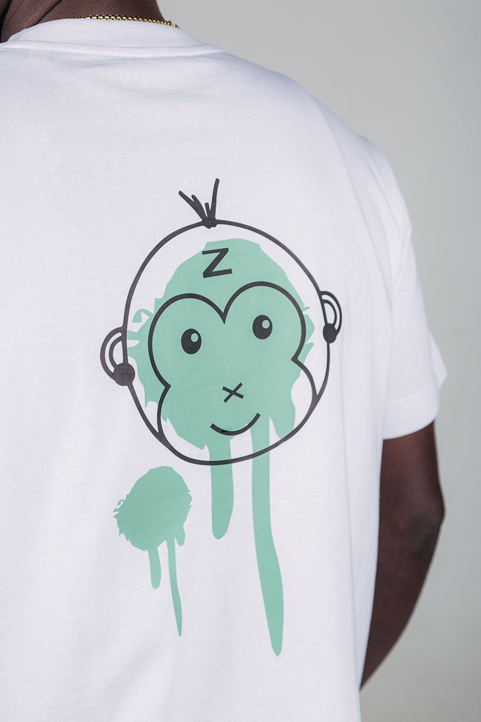 Zengange Premium – White colored T-shirt with green details.